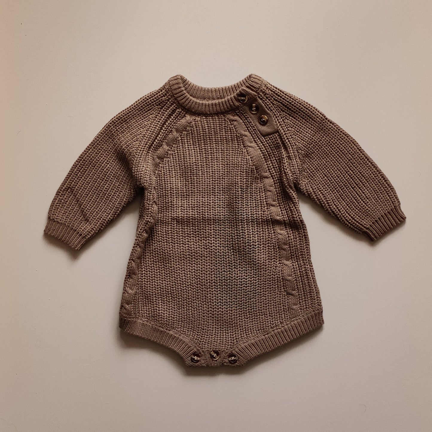 Knitted baby romper